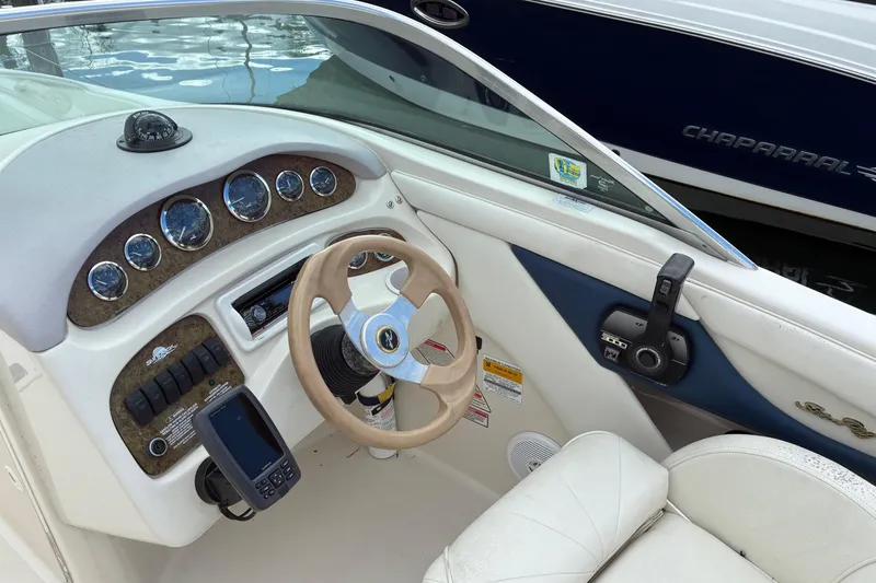 Slide: The Image of Interior view of 1999 Sea Ray 210 Sundeck boat dashboard and steering wheel. - 6