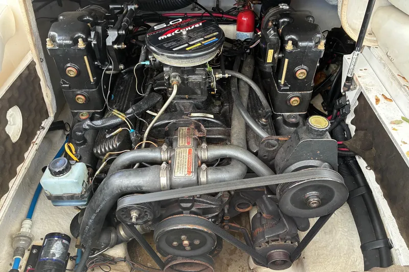 Slide: The Image of Engine of a 1999 Sea Ray 210 Sundeck boat, showcasing mechanical components. - 7