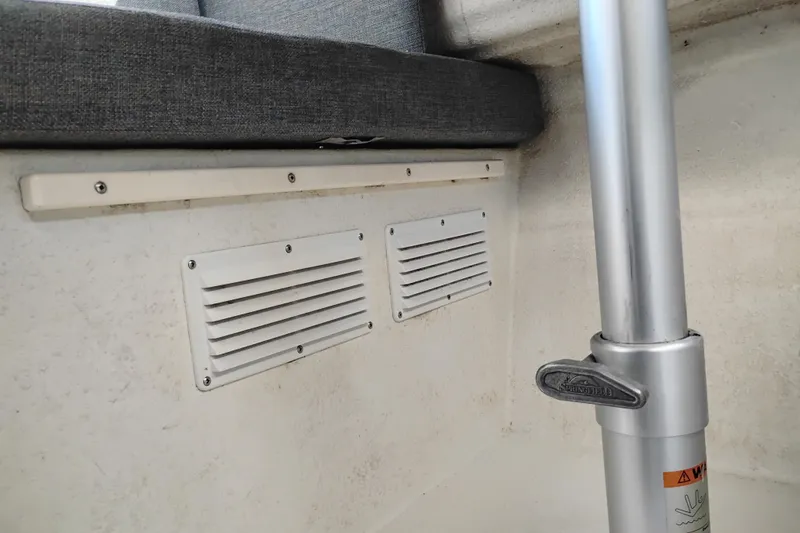 Slide: The Image of Interior of 1997 SeaSport Explorer 2400 boat showing vents and seat cushion. - 20