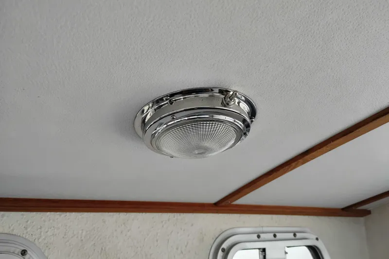 Slide: The Image of Ceiling light fixture inside 1997 SeaSport Explorer 2400 boat cabin. - 22