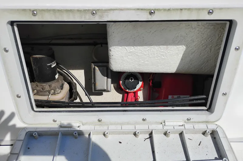 Slide: The Image of 1997 SeaSport Explorer 2400 boat compartment with electrical components and wiring. - 9