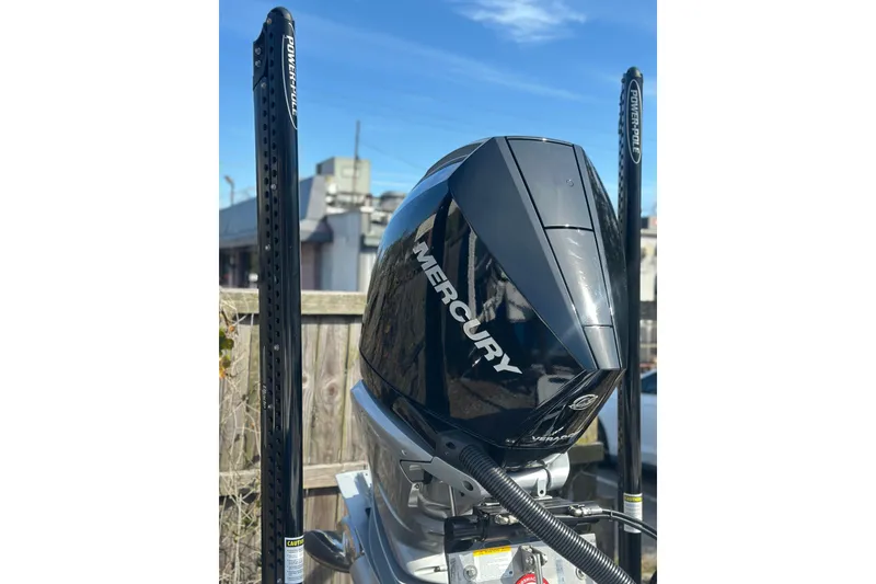 Slide: The Image of Powerful Mercury outboard engine on BlackJack 224, 2025 model, with Power-Pole anchors. - 6