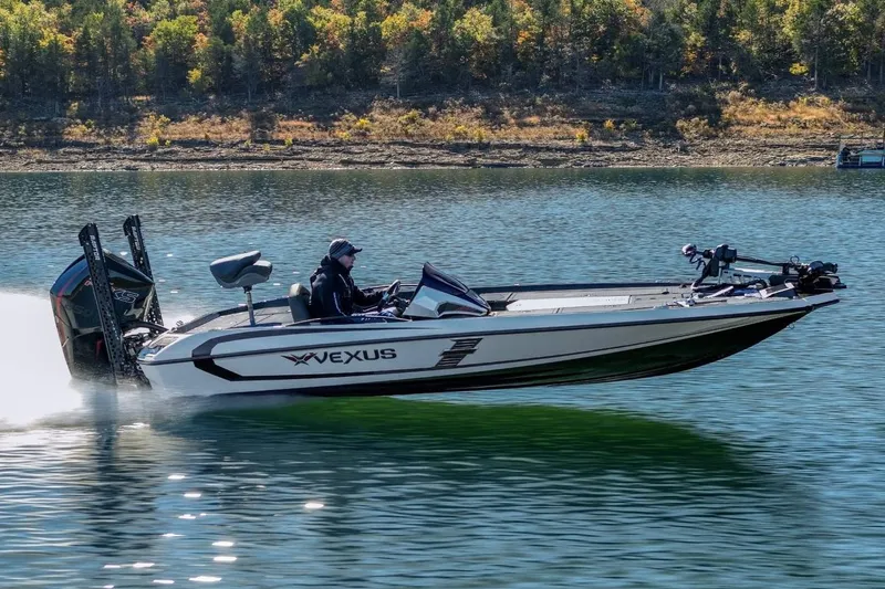 Slide: The Image of Manufacturer Provided Image: 2026 Vexus VXs20 boat speeding on a lake with scenic forest backdrop. - 14