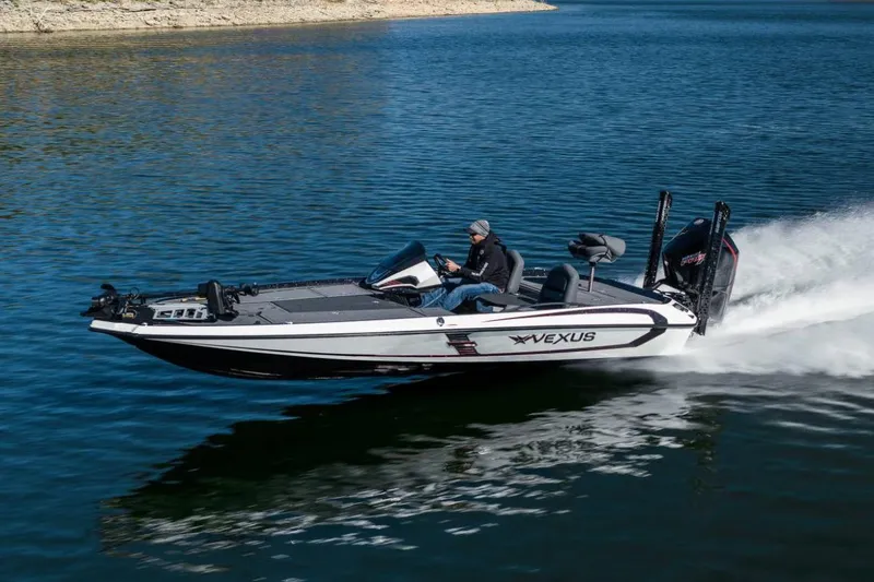 Slide: The Image of Manufacturer Provided Image: 2026 Vexus VXs20 boat speeding on a lake, showcasing sleek design and performance. - 15