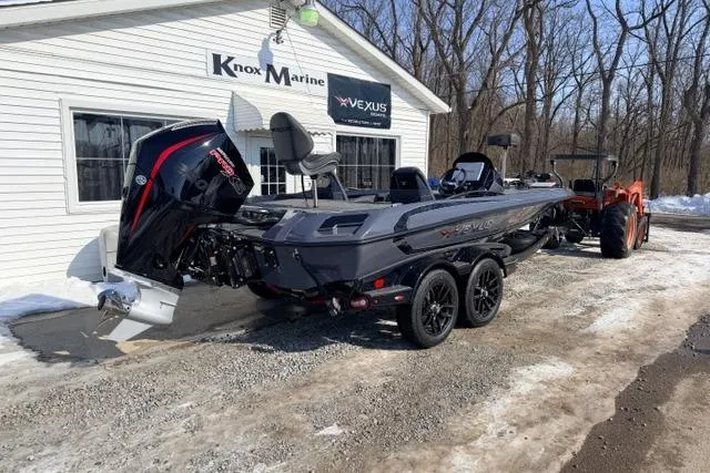 Slide: The Image of 2026 Vexus VXs20 boat on trailer outside Knox Marine dealership. - 2