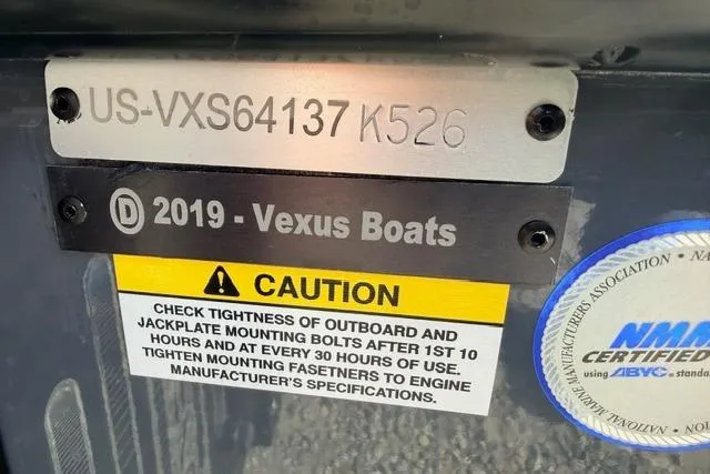 Slide: The Image of 2026 Vexus VXs20 boat identification plate with caution label and certification sticker. - 3