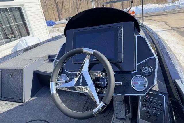 Slide: The Image of 2026 Vexus VXs20 boat dashboard with steering wheel and digital display. - 5