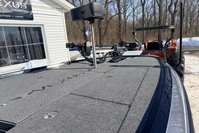 Slide: The Image of 2026 Vexus VXs20 boat deck with equipment, parked near a snowy wooded area. - 7