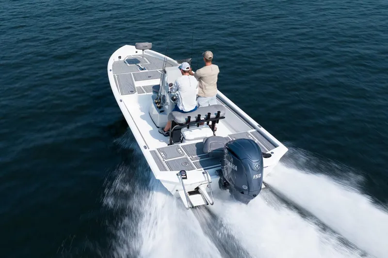 Slide: The Image of Manufacturer Provided Image: Avid 21 Mag 2026 boat on water with two people. - 2