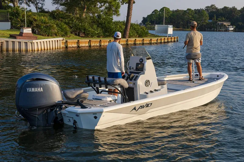 Slide: The Image of Manufacturer Provided Image: Avid 21 Mag boat 2026 on calm water with two people. - 4