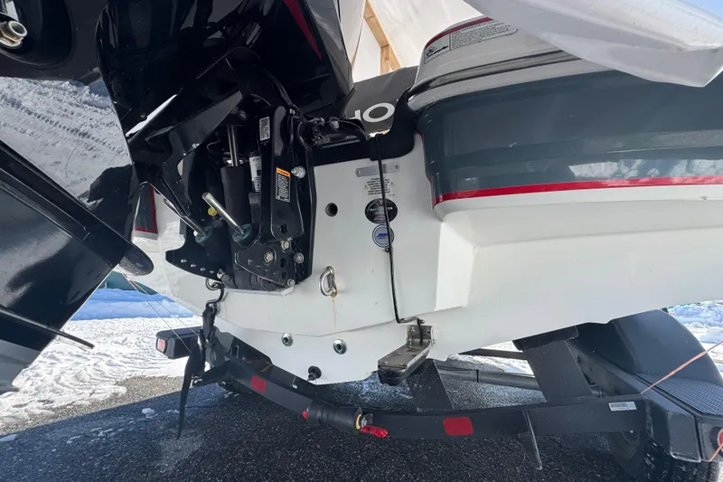 Slide: The Image of Rear view of a 2023 Tahoe 1950 boat on a trailer, showcasing the engine and propeller. - 3