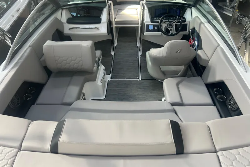Slide: The Image of 2026 Four Winns H2 boat interior with modern seating and sleek dashboard design. - 16