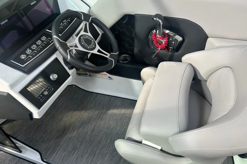 Slide: The Image of 2026 Four Winns H2 boat interior with steering wheel and control panel. - 20