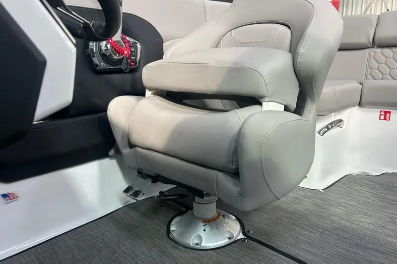 Slide: The Image of Captain's seat in 2026 Four Winns H2 boat, featuring sleek gray upholstery. - 21