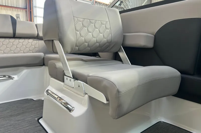 Slide: The Image of 2026 Four Winns H2 boat interior with gray leather seating and hexagonal stitching. - 23