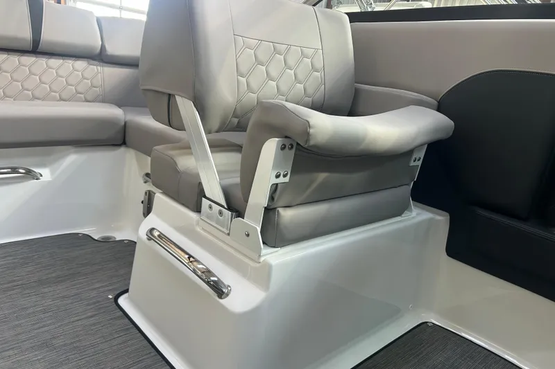 Slide: The Image of 2026 Four Winns H2 boat interior with gray cushioned seating and modern design. - 24