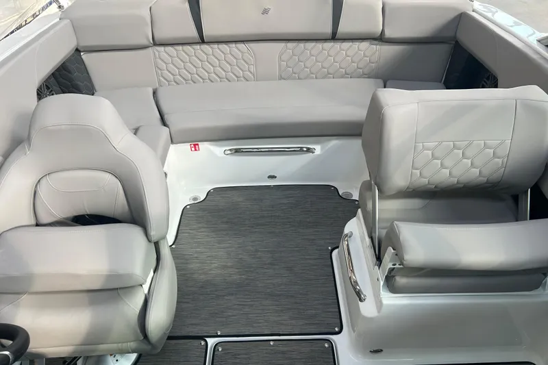 Slide: The Image of 2026 Four Winns H2 boat interior with gray seating and modern design. - 25