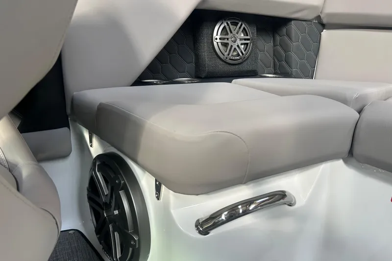 Slide: The Image of 2026 Four Winns H2 boat interior with cushioned seating and integrated speaker system. - 29