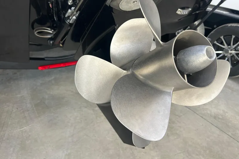 Slide: The Image of Close-up of a 2026 Four Winns H2 boat propeller in a garage setting. - 3