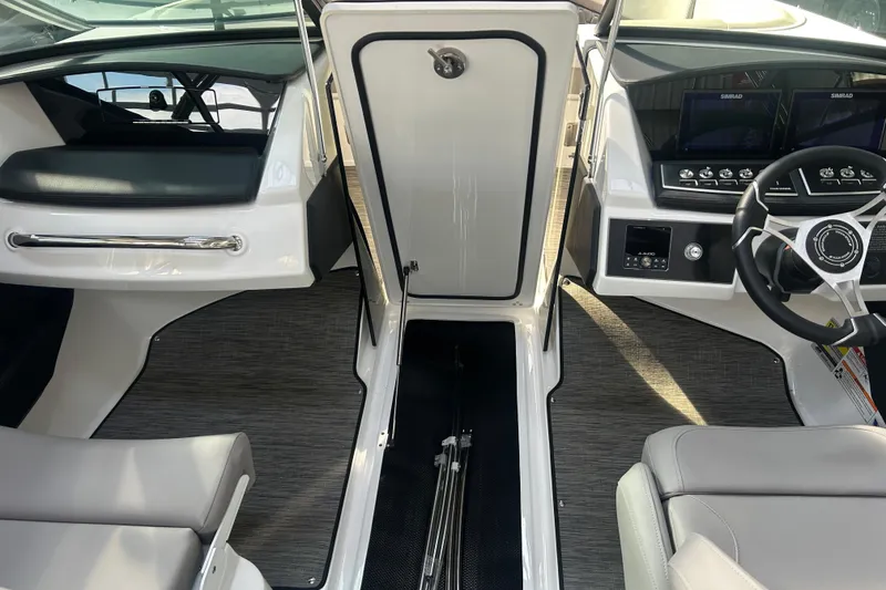 Slide: The Image of 2026 Four Winns H2 boat interior with modern dashboard and seating. - 31