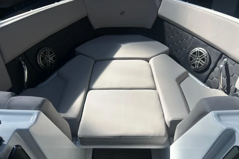 Slide: The Image of 2026 Four Winns H2 boat interior with cushioned seating and built-in speakers. - 36