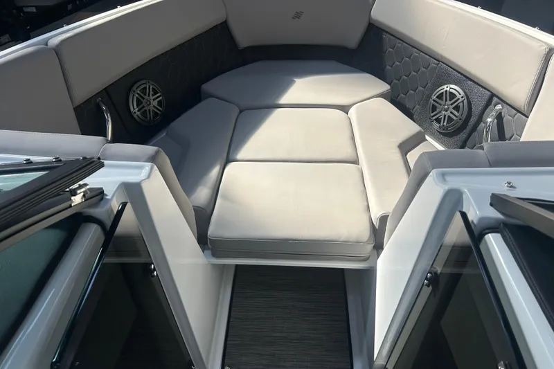 Slide: The Image of 2026 Four Winns H2 boat interior with cushioned seating and built-in speakers. - 37