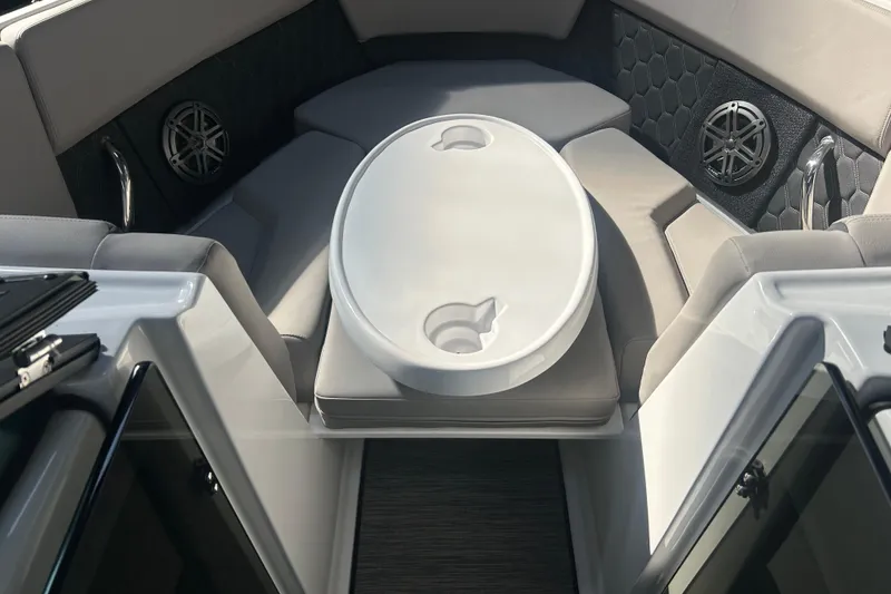 Slide: The Image of Interior of 2026 Four Winns H2 boat with seating and table. - 38