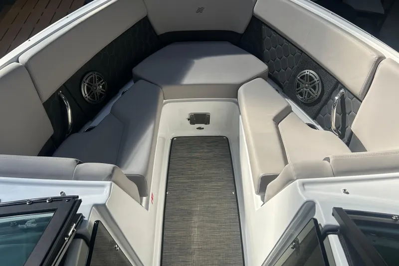 Slide: The Image of Luxurious interior of 2026 Four Winns H2 boat with cushioned seating and speakers. - 39