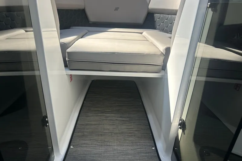 Slide: The Image of Interior view of 2026 Four Winns H2 boat, featuring cushioned seating and sleek design. - 40