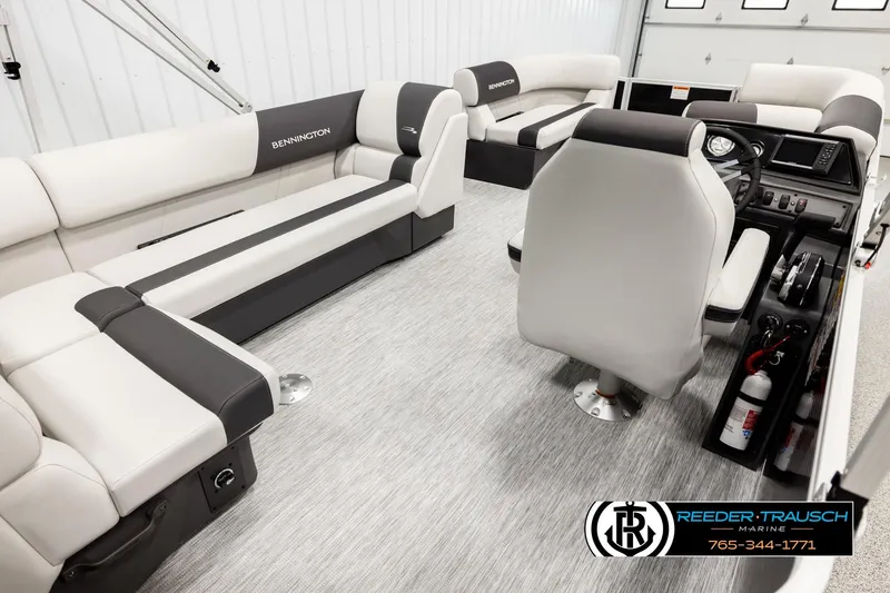 Slide: The Image of Interior of 2026 Bennington SLSF pontoon boat with modern seating and control console. - 12