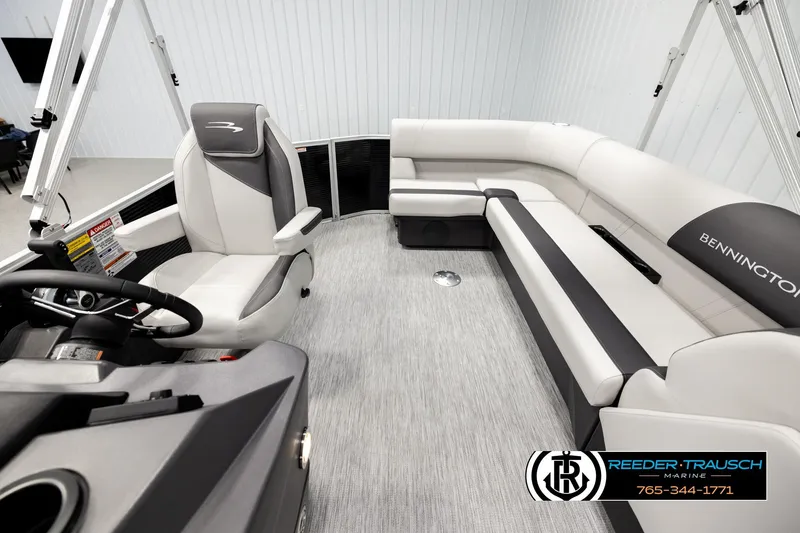 Slide: The Image of Luxurious interior of 2026 Bennington SLSF pontoon boat with plush seating and modern design. - 14