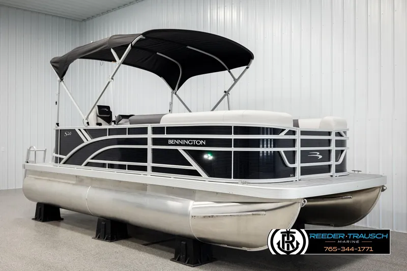 Slide: The Image of 2026 Bennington SLSF pontoon boat with canopy in showroom display. - 3
