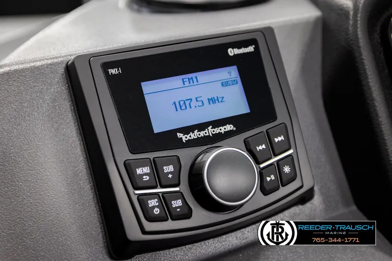 Slide: The Image of 2026 Bennington SLSF boat stereo system with Bluetooth and FM radio display. - 30