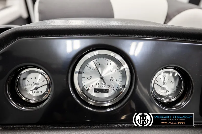 Slide: The Image of Dashboard of 2026 Bennington SLSF boat with trim, RPM, and fuel gauges. - 32