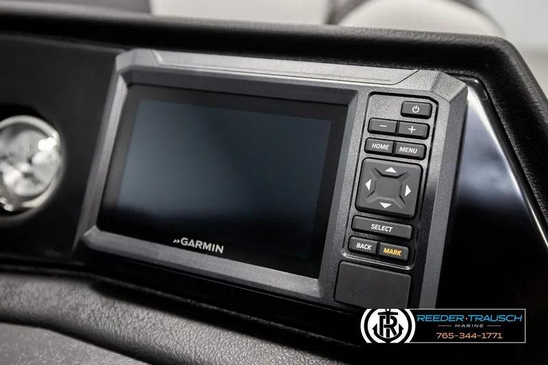 Slide: The Image of Garmin display on 2026 Bennington SLSF boat dashboard, featuring control buttons. - 33