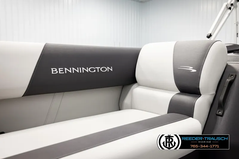 Slide: The Image of 2026 Bennington SLSF boat interior with branded seating, Reeder-Trausch Marine logo visible. - 39