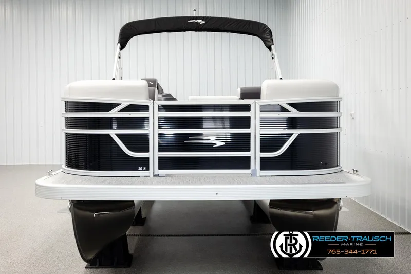 Slide: The Image of 2026 Bennington SLSF pontoon boat in showroom, featuring sleek design and modern amenities. - 8