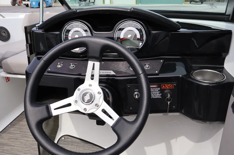 Slide: The Image of Steering wheel and dashboard of 2026 Four Winns HD2 boat. - 14