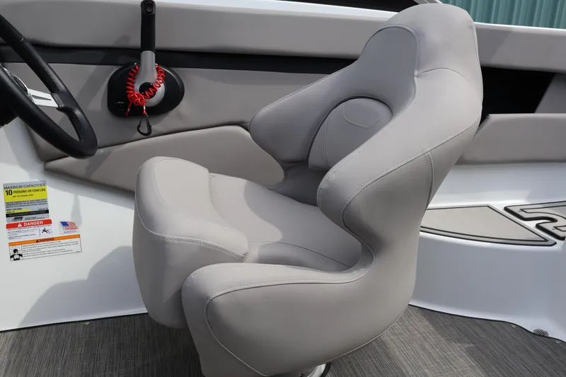 Slide: The Image of 2026 Four Winns HD2 boat interior with gray captain's chair and control panel. - 15