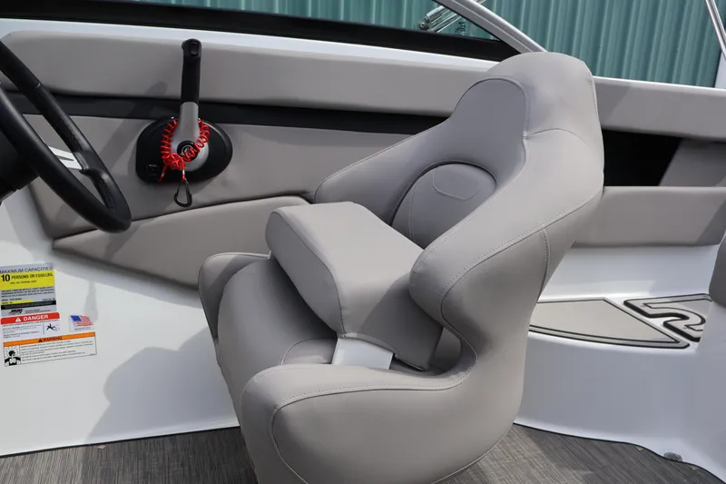 Slide: The Image of Interior of 2026 Four Winns HD2 boat featuring a sleek, modern captain's chair. - 16