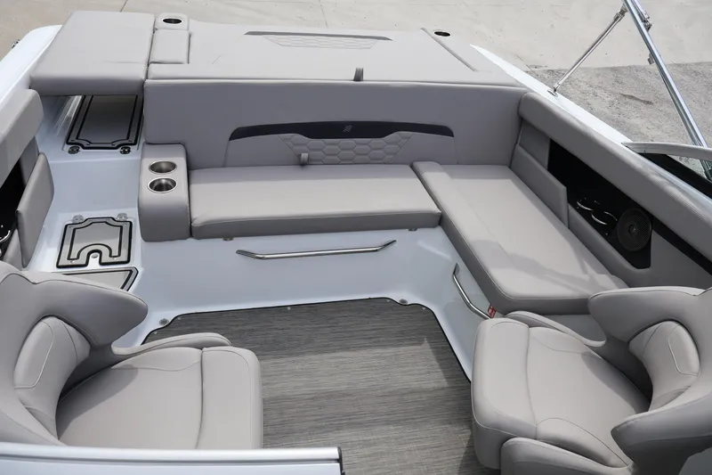 Slide: The Image of 2026 Four Winns HD2 boat interior with gray seating and cup holders. - 19