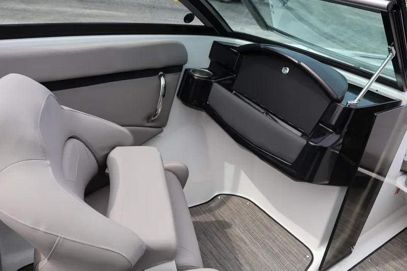 Slide: The Image of Interior of 2026 Four Winns HD2 boat with modern seating and dashboard design. - 20