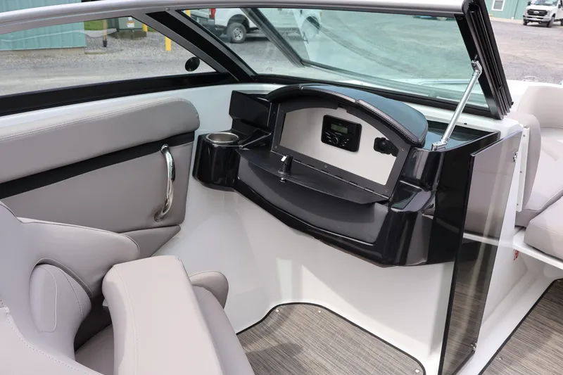 Slide: The Image of Interior of 2026 Four Winns HD2 boat with modern seating and dashboard. - 21