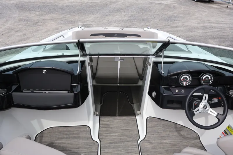 Slide: The Image of Interior view of 2026 Four Winns HD2 boat cockpit with steering wheel and dashboard. - 23