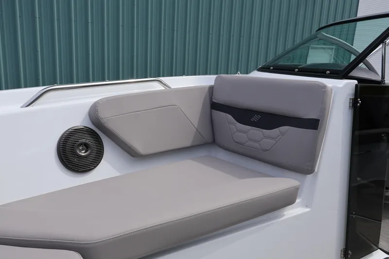 Slide: The Image of 2026 Four Winns HD2 boat interior with gray seating and speaker. - 26