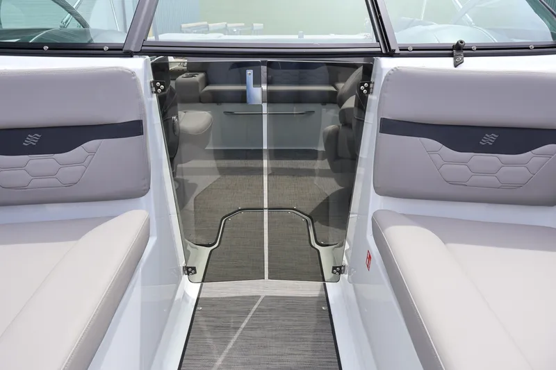 Slide: The Image of Interior view of 2026 Four Winns HD2 boat with sleek seating and glass door. - 27