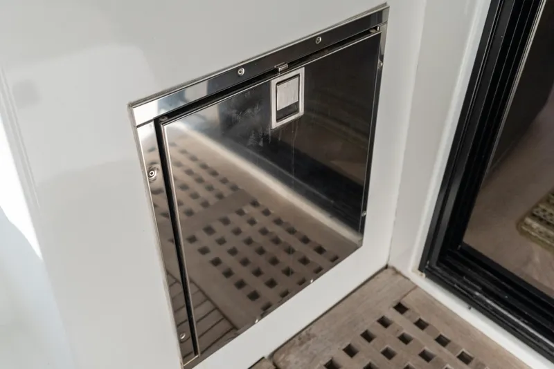 Slide: The Image of Stainless steel hatch on 2020 Lagoon 42 yacht, featuring sleek design and wooden flooring. - 13