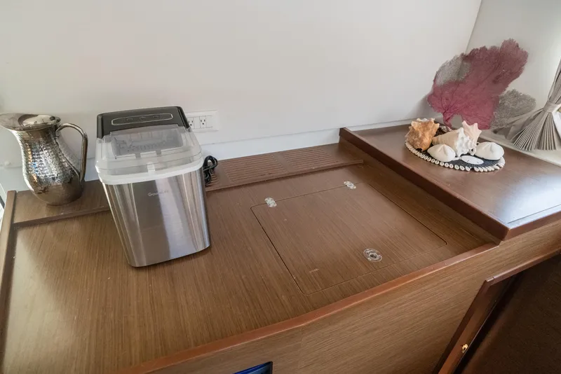 Slide: The Image of Interior of 2020 Lagoon 42 yacht with ice maker and decorative seashells. - 21