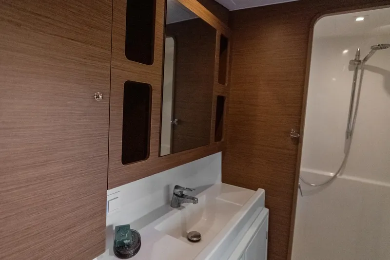 Slide: The Image of Modern bathroom interior of 2020 Lagoon 42 yacht with wood accents and shower. - 30