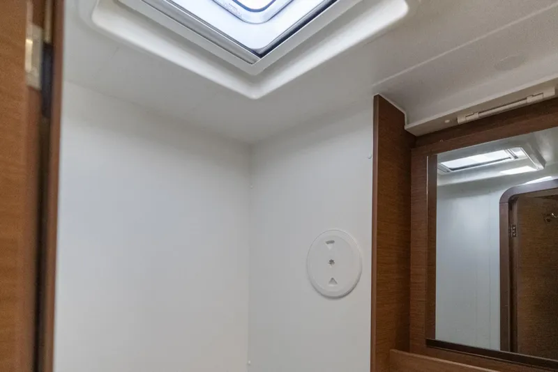 Slide: The Image of Interior of 2020 Lagoon 42 yacht bathroom with skylight and mirror. - 38